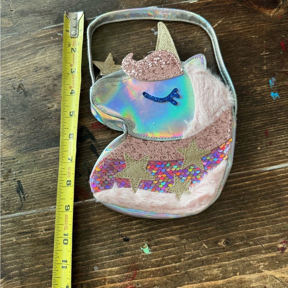 Cute little metallic unicorn purse!NWOT purchased 4 a movie prop but wasn’t used